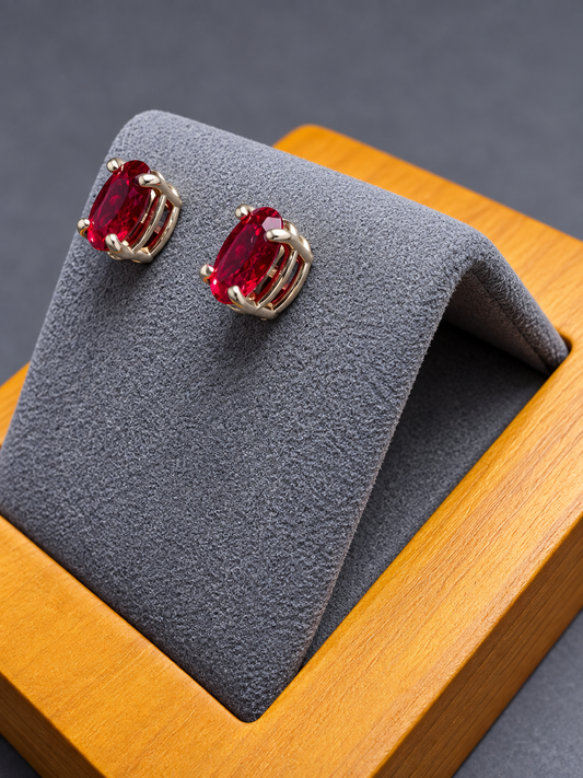 7x5mm Oval Hydrothermal Ruby Stud Earrings – 14K Yellow Gold